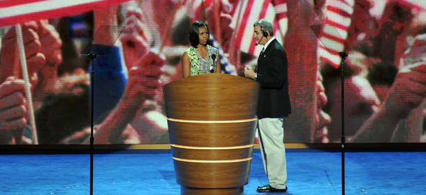 US First Lady Michelle Obama (C) works with a stage manager (R) during a rehearsal for her speech in the Time Warner Cable Arena September 3, 2012 in Charlotte, North Carolina as preparations for the 2012 Democratic National Convention continue. AFP PHOTO / Stan HONDA (Photo credit should read STAN HONDA/AFP/GettyImages)