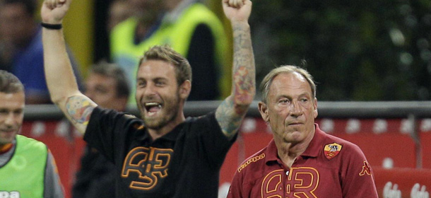 AS Roma coach Zdenek Zeman, right, and AS Roma midfielder Daniele De Rossi react after winning the Serie A soccer match between Inter Milan and Roma at the San Siro stadium in Milan, Italy, Sunday, Sept. 2, 2012. Roma won 3-1. (AP Photo/Antonio Calanni)
