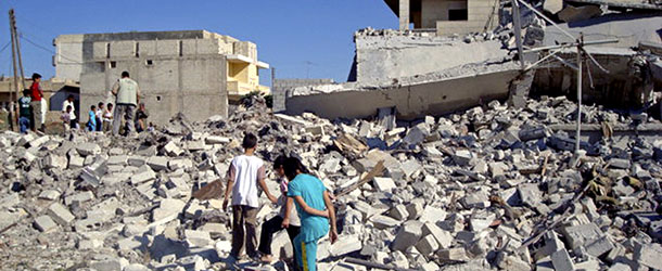 This citizen journalism image provided by Shaam News Network SNN, taken on Monday, Sept. 3, 2012, purports to show civilians walking among the rubble of buildings damaged by airstrikes in Azaz, on the outskirts of Aleppo, Syria. Syria's information minister told reporters Monday, Sept. 3, 2012 that there will be no dialogue with the opposition before the army crushes the rebels. (AP Photo/Shaam News Network, SNN) THE ASSOCIATED PRESS IS UNABLE TO INDEPENDENTLY VERIFY THE AUTHENTICITY, CONTENT, LOCATION OR DATE OF THIS CITIZEN JOURNALIST IMAGE