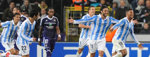 Malaga&#8217;s Portuguese midfielder Eliseu (R) celebrates with teammates after scoring against RSC Anderlecht during their Champions League football match at the Constant Vanden Stock Stadium on October 3, 2012 in Brussels. AFP PHOTO/JOHN THYS (Photo credit should read JOHN THYS/AFP/GettyImages)
