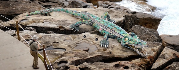 A man looks at a sculpture called &#8216;Ghost Net Crocodile 2011&#8242; by remote community indigenous artists at the Sculpture by the Sea exhibition in Sydney on October 18, 2012. More than 100 works of art are displayed in the world&#8217;s largest annual free-to-the-public outdoor sculpture exhibition which runs along the coastal foothpath between Sydney&#8217;s Bondi Beach and Tamarama Beach. AFP PHOTO/William WEST
RESTRICTED TO EDITORIAL USE, MANDATORY CREDIT OF THE ARTIST, TO ILLUSTRATE THE EVENT AS SPECIFIED IN THE CAPTION (Photo credit should read WILLIAM WEST/AFP/Getty Images)
