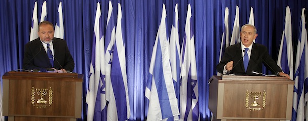 Israeli Prime Minister Benjamin Netanyahu (R) and Foreign Minister Avigdor Lieberman give a joint news conference in Jerusalem on October 25, 2012. Netanyahu and the ultra-nationalist Avigdor Lieberman said they will join forces for a general election, boosting the premier&#8217;s position as favourite. AFP PHOTO/LIOR MIZRAHI === ISRAEL OUT ===
 (Photo credit should read LIOR MIZRAHI/AFP/Getty Images)
