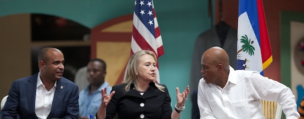Secretary of State Hillary Rodham Clinton, center, speaks to Haiti&#8217;s President Michel Martelly, right, during the inauguration of the Caracol Haiti Industrial Park on the outskirts of Cap Hatien, Haiti, Monday, Oct. 22, 2012. Clinton encouraged foreigners to invest in Haiti as she and her husband Bill led a star-studded delegation gathered Monday to inaugurate the new industrial park at the center of U.S. efforts to help the country rebuild after the 2010 earthquake. At left, Haiti&#8217;s Prime Minister Laurent Lamothe. (AP Photo/Dieu Nalio Chery)

