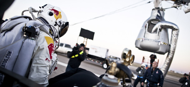 In this photo provided by Red Bull, Pilot Felix Baumgartner of Austria steps out from his trailer during the final manned flight for Red Bull Stratos in Roswell, N.M. on Saturday, Oct. 14, 2012. Baumgartner plans to jump from an altitude of 120,000 feet, an altitude chosen to enable him to achieve Mach 1 in free fall, which would deliver scientific data to the aerospace community about human survival from high altitudes.(AP Photo/Red Bull, Balazs Gardi)

