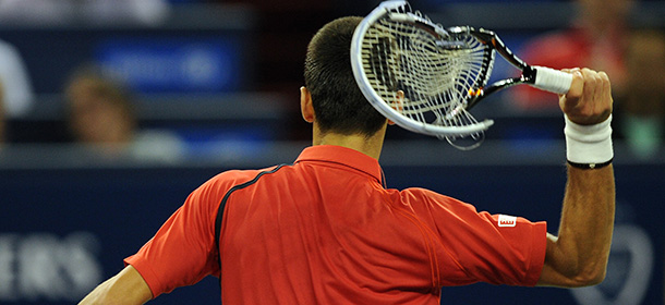Novak Djokovic of Serbia smashes his racquet in frustration during the final against Andy Murray of Britain at the Shanghai Masters tennis tournament in Shanghai on October 14, 2012. AFP PHOTO/Peter PARKS (Photo credit should read PETER PARKS/AFP/GettyImages)
