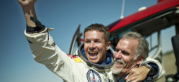 In this photo provided by Red Bull Stratos, pilot Felix Baumgartner of Austria and Technical Project Director Art Thompson, celebrate after successfully completing the final manned flight for Red Bull Stratos in Roswell, N.M., Sunday, October 14, 2012.â Baumgartner came down safely in the eastern New Mexico desert minutes about nine minutes after jumping from his capsule 128,097 feet, or roughly 24 miles, above Earth. (AP Photo/Red Bull Stratos, Joerg Mitter)

