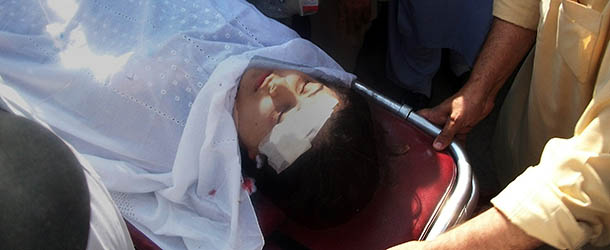 Pakistani hospital workers carry injured Malala Yousafzai, 14, on a stretcher at a hospital following an attack by gunmen in Mingora on October 9, 2012. A teenage Pakistani children&#8217;s rights activist was shot in the head in an assassination attempt as she boarded a school bus in the former Taliban stronghold of Swat, officials said. AFP PHOTO / STR (Photo credit should read STR/AFP/GettyImages)
