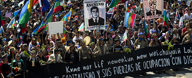 Thousands of ethnic Mapuches, Chile&#8217;s largest indigenous group, participate in a protest rally in Santiago on October 15, 2012. Hundreds of indigenous Chileans and members of social organizations marched demanding the restitution of their ancestral lands &#8212; just days after the 520th anniversary of Christopher Columbus&#8217; arrival in America. AFP PHOTO/Martin BERNETTI (Photo credit should read MARTIN BERNETTI/AFP/GettyImages)
