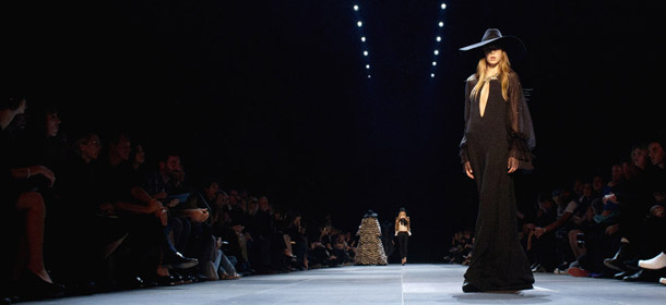 A model presents a creation for Saint Laurent during the Spring/Summer 2013 ready-to-wear collection show on October 1, 2012 in Paris. AFP PHOTO/MARTIN BUREAU (Photo credit should read MARTIN BUREAU/AFP/GettyImages)
