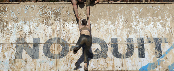 ENGLISHTOWN, NJ &#8211; OCTOBER 21: Participants compete at the Everest obstacle in the Tough Mudder event at Raceway Park on October 21, 2012 in Englishtown, New Jersey. (Photo by Bruce Bennett/Getty Images)
