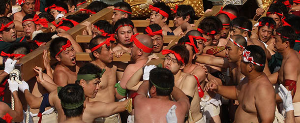 HIMEJI, JAPAN &#8211; OCTOBER 15: Japanese Shrine Parishioners of Matsubara carry Yatai (portable shrine) during a parade as part of the Nada No Kenka Matsuri (Nada Fight Festival) at Matsubara on October 15, 2012 in Himeji, Japan. Each Yatai weighs approximately two tonnes. The parade is the highlight of the shrine&#8217;s Autumn Harvest Festival and attracts roughly 100,000 people. (Photo by Buddhika Weerasinghe/Getty Images)

