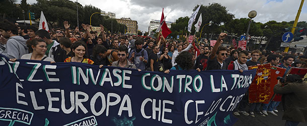 Demonstrators march during the No Monti Day demonstration on October 27, 2012 in Rome. The No Monti Day demonstration is organized by the small left-wing parties and various protest groups against Italian Prime Minister Mario Monti&#8217;s austerity measures. AFP PHOTO / FILIPPO MONTEFORTE (Photo credit should read FILIPPO MONTEFORTE,FILIPPO MONTEFORTE/AFP/Getty Images)
