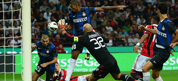 Inter Milan&#8217;s defender Adrian Samuel (L) scores in front of AC Milan&#8217;s goalkeeper Chistian Abbiati (C) during the serie A match between AC Milan and Inter on October 7, 2012 in Milan at the San Siro stadium . AFP PHOTO / OLIVIER MORIN (Photo credit should read OLIVIER MORIN/AFP/GettyImages)
