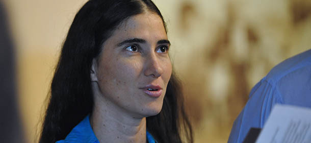 Cuban blogger Yoani Sanchez talks with a member of former US President Jimmy Carter&#8217;s staff (not depicted) at the hotel in Havana where Carter is staying in, on March 30, 2011. Yoani and a group of Cuban dissidents were received by Carter who wanted to hear their political point of view about the Cuban government. AFP PHOTO/ADALBERTO ROQUE (Photo credit should read ADALBERTO ROQUE/AFP/GettyImages)
