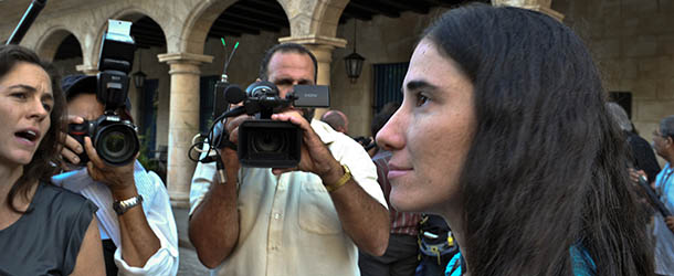 Cuban blogger Yoani Sanchez (R) talks to the press after meeting with former US president Jimmy Carter at the hotel in Havana where he is staying in, on March 30, 2011. Yoani and a group of Cuban dissidents were received by Carter who wanted to hear their political point of view about the Cuban government. AFP PHOTO/ADALBERTO ROQUE (Photo credit should read ADALBERTO ROQUE/AFP/Getty Images)
