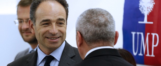 UMP general secretary Jean-FranÃ§ois Cope speaks with a man at the UMP headquarters in Paris. AFP PHOTO THOMAS SAMSON (Photo credit should read THOMAS SAMSON/AFP/Getty Images)
