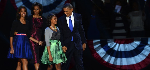 US President Barack Obama and family arrive on stage after winning the 2012 US presidential election November 7, 2012 in Chicago, Illinois. Obama swept to re-election, forging history again by defying the dragging economic recovery and high unemployment which haunted his first term to beat Republican Mitt Romney. AFP PHOTO / Saul LOEB (Photo credit should read SAUL LOEB/AFP/Getty Images)
