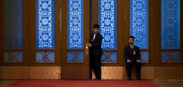 Security guards check a doorway inside the Great Hall of the People in Beijing on November 9, 2012. The week-long congress, held every five years, will end with a transition of power to Vice President Xi Jinping, who will govern for the coming decade amid growing pressure for reform of the communist regime&#8217;s iron-clad grip on power. AFP PHOTO / Ed Jones (Photo credit should read Ed Jones/AFP/Getty Images)
