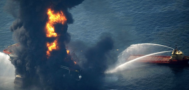 In this aerial photo taken in the Gulf of Mexico more than 50 miles southeast of Venice on Louisiana&#8217;s tip, the Deepwater Horizon oil rig is seen burning Wednesday, April 21, 2010. (AP Photo/Gerald Herbert)

