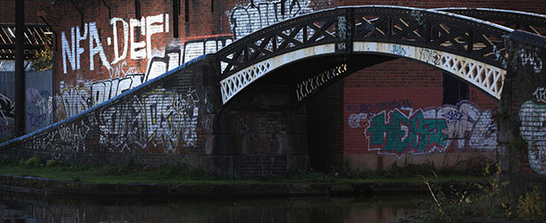 BIRMINGHAM, ENGLAND &#8211; NOVEMBER 15: Graffiti covers the walls of the canalside at Icknield Port Loop which was due to be rejuvenated by Advantage West Midlands but has been put on hold after the regeneration agency was scrapped by the government on on November 15, 2010 in Birmingham, England. Advantage West Midlands is one of nine regional development agencies across England to be scrapped by the government and will be replaced by Local Enterprise Partnerships. The 65 acre Icknield Port Loop canal basin was one of the many regeneration projects across England to be put on hold after government plans to cut the deficit. (Photo by Christopher Furlong/Getty Images)
