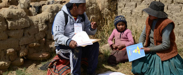 A census enumerator asks questions to an aymara family at the Wichi Wichi community, 40 Km from La Paz in the Bolivian high plateau, during a national census day on November 21, 2012. Bolivia is taking of a census of its about 10 million people for the first time in 11 years. AFP PHOTO/Aizar Raldes (Photo credit should read AIZAR RALDES/AFP/Getty Images)
