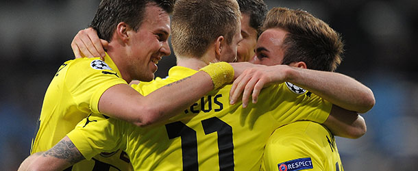 MADRID, SPAIN &#8211; NOVEMBER 06: Marco Reus #11 of Borussia Dortmund celebrates with teammates after scoring Borussia&#8217;s opening goal during the UEFA Champions League Group D match between Real Madrid and Borussia Dortmund at Estadio Santiago Bernabeu on November 6, 2012 in Madrid, Spain. (Photo by Denis Doyle/Getty Images)
