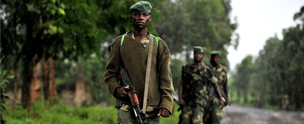 M23 rebel group soldiers patrol on October 17, 2012 in Rangira, near Rutshuru. Two rebel groups active in the Democratic Republic of Congo&#8217;s restive east, the M23 and FDLR, have formed an alliance and clashed with the country&#8217;s military, an army spokesman said on October 17. AFP PHOTO / Junior D.Kannah (Photo credit should read Junior D. Kannah/AFP/Getty Images)
