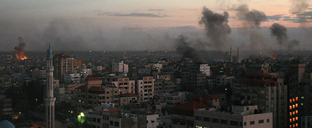 Columns of smoke rise following an Israeli air strike in Gaza City, Wednesday, Nov. 14, 2012. Palestinian witnesses say Israeli airstrikes have hit a series of targets across Gaza City, shortly after the assassination of the top Hamas commander. Hamas security officials say two Hamas training facilities were among the targets in the Wednesday afternoon bombings. (AP Photo/Adel Hana)
