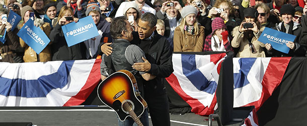 President Barack Obama and singer Bruce Springsteen embrace during a campaign event near the State Capitol Building in Madison, Wis., Monday, Nov. 5, 2012. (AP Photo/Pablo Martinez Monsivais)
