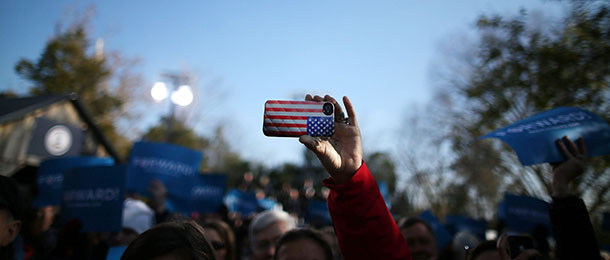 STERLING, VA &#8211; NOVEMBER 05: A cell phone with an American flag cover is held up as U.S. Vice President Joe Biden speaks during a campaign rally at the Heritage Farm Museum, on November 5, 2012 in Sterling, Virginia. Tomorrow voters nationwide will head to the polls to vote in the presidential and congressional elections. (Photo by Mark Wilson/Getty Images)
