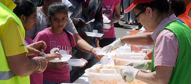 NOVI DI MODENA, ITALY &#8211; MAY 30: Volunteers serve lunch to evacuees at Protezione Civile&#8217;s field in Novidi Modena damaged by the earthquake on May 30, 2012 in Novi Di Modena, Italy. Following a second series of strong earthquakes across the Emilia-Romagna region yesterday the death toll has risen to 17 people with more than 15,000 displaced. A further 50 aftershocks were felt during the night, the strongest of which measured 3.54 on the richter scale. (Photo by Roberto Serra/Iguana Press/Getty Images)

