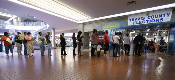 Voters wait in line at a polling place located inside a shopping mall, on Election Day, Tuesday, Nov. 6, 2012, in Austin, Texas. (AP Photo/Eric Gay)
