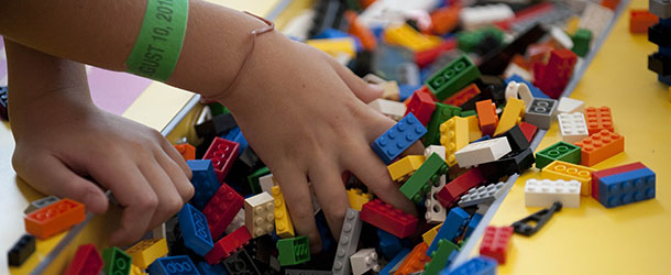 A child plays with LEGO building blocks while visiting the National Building Museum&#8217;s exhibit &#8220;Lego Architecture: Towering Ambition&#8221; in Washington, DC, August 10, 2010. AFP PHOTO/Jim WATSON (Photo credit should read JIM WATSON/AFP/Getty Images)
