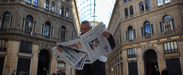 NAPLES, ITALY &#8211; NOVEMBER 14: A man in Galeria Umberto reads a newspaper declaring Italy&#8217;s new prime minister on November 14, 2011 in Naples, Italy. Italian Prime Minster Mario Monti is in the process of selecting his new government after the resignation of Silvio Berlusconi. Mario Monti is facing the task of reducing Italy&#8217;s debt and gaining the confidence of world economic markets and said he wanted to create &#8220;a future of dignity and hope&#8221; for Italy&#8217;s children. (Photo by Christopher Furlong/Getty Images)
