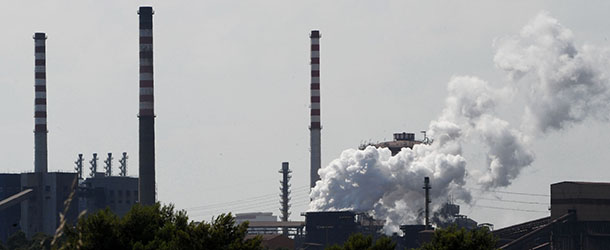 A view of the ILVA plant in the southern Italian city of Taranto on August 2, 2012. Thousands of Italians took to the streets in the southern city of Taranto Thursday in rival protests over the closure of one of Europe&#8217;s largest steel plants due to pollution concerns. The impoverished industrial port has become the scene of a fierce stand-off between those who want the deadly ILVA plant closed and the thousands of families that depend on it at a time of worsening economic crisis in Italy. Eight ILVA executives have been put under house arrest following expert findings that chemicals spilling from the plant are behind high cancer rates. AFP PHOTO / MARIO LAPORTA (Photo credit should read MARIO LAPORTA/AFP/GettyImages)
