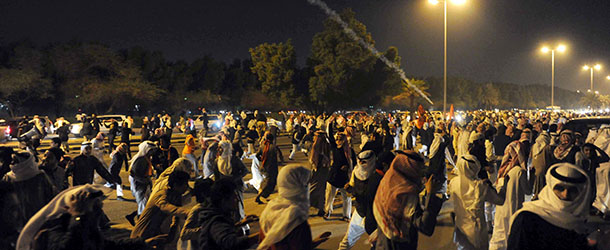 Kuwaiti opposition supporters march on a major road in Sabah al-Nasser, district of Kuwait City on December 3, 2012, during a demonstration to press demands for abolishing the new parliament and scrapping a disputed amendment to the electoral law. AFP PHOTO / YASSER AL-ZAYYAT (Photo credit should read YASSER AL-ZAYYAT/AFP/Getty Images)
