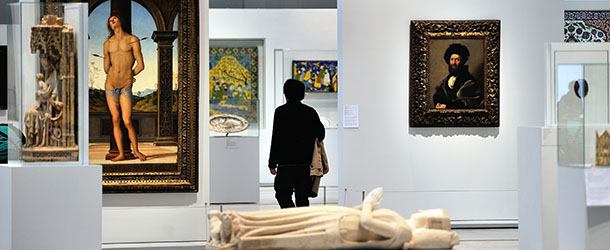 An man walks by &#8220;Saint Sebastian&#8221; (L) by Perugino in the &#8220;great gallery of time&#8221; at the Louvre-Lens Museum on December 3, 2012 in the French northern city of Lens. AFP PHOTO PHILIPPE HUGUEN (Photo credit should read PHILIPPE HUGUEN/AFP/Getty Images)
