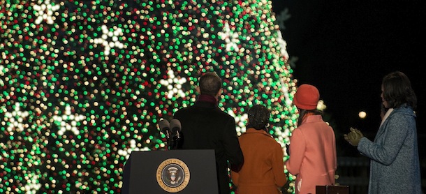 US President Barack Obama, Sasha Obama, Malia Obama and US First Lady Michelle Obama look at the National Christmas Tree during the 90th annual National Christmas Tree Lighting on the Ellipse of the National Mall December 6, 2012 in Washington, DC. Obama and others attended the event which included entertainment before the lighting of the National Christmas Tree. AFP PHOTO/Brendan SMIALOWSKI (Photo credit should read BRENDAN SMIALOWSKI/AFP/Getty Images)
