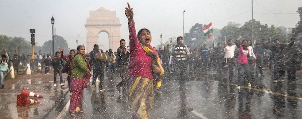 NEW DELHI, INDIA &#8211; DECEMBER 23: A protestors chants slogans as she braces herself against the spray fired from Police water canons during a protest against the Indian governments reaction to recent rape incidents in India, in front of India Gate on December 23, 2012 in New Delhi, India. The gang rape of a 23-year-old paramedical student in a moving bus on December 16, in Delhi, has led to people to react openly against the governments current rape laws. Over a thousand protesters gathered in front of Delhi to protest against lax laws and the governments handling of recent rape cases all over India. (Photo by Daniel Berehulak/Getty Images)
