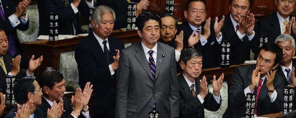 Shinzo Abe (C) is applauded by parliament members after he was elected as Japan&#8217;s prime minister by the lower house of parliament in Tokyo on December 26, 2012. The powerful lower house named the 58-year-old as the country&#8217;s new leader following a resounding national election victory for Abe&#8217;s Liberal Democratic Party earlier this month over the booted Democratic Party of Japan (DPJ) AFP PHOTO/Toru YAMANAKA (Photo credit should read TORU YAMANAKA/AFP/Getty Images)
