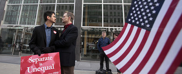 In this file photo from Jan. 11, 2010, Stuart Gaffney, left, and John Lewis, same-sex partners for 22 years, huddle outside of the federal courthouse in San Francisco. The U.S. Supreme Court decided Friday, Dec. 7, 2012, to hear the appeal of a ruling that struck down Proposition 8, the stateâs measure that banned same sex marriages. The highly anticipated decision by the court means same-sex marriages will not resume in California any time soon. The justices likely will not issue a ruling until spring of next year. A federal appeals court ruled in February that Proposition 8âs ban on same-sex marriage was unconstitutional. But the court delayed implementing the order until same-sex marriage opponents proponents could ask the U.S. Supreme Court to review the ruling. (AP Photo/Marcio Jose Sanchez)
