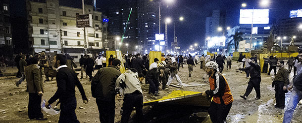 Members of the Muslim Brotherhood and supporters of Egyptian President Mohamed Morsi build barricades as they clash with anti-Morsi demonstrators on the road leading to the Egyptian presidential palace on December 5, 2012 in Cairo. Supporters and opponents of Egypt&#8217;s President Mohamed Morsi lobbed firebombs and rocks at each other as their standoff over his expanded powers and an Islamist-drafted constitution turned violent. AFP PHOTO/GIANLUIGI GUERCIA (Photo credit should read GIANLUIGI GUERCIA/AFP/Getty Images)
