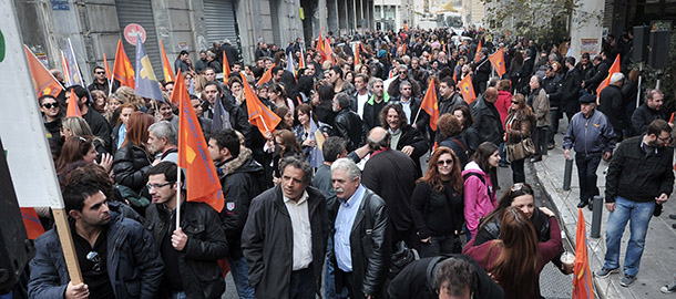 Hundreds of Hellenic Postbank employees gather outside their Bank&#8217;s headquarters prior their march to the Finance ministry in Athens on December 17, 2012 to protest against the privatisation of the company . .AFP PHOTO / LOUISA GOULIAMAKI (Photo credit should read LOUISA GOULIAMAKI/AFP/Getty Images)
