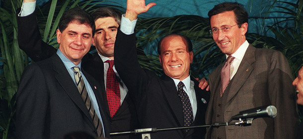 Silvio Berlusconi, center, leader of the center-right coalition Polo delle Liberta&#8217; (Freedom Alliance), waves to supporters during a rally in downtown Piazza Navona in Rome Friday April 19, 1996. At right is Gianfranco Fini, leader of the right-wing National Alliance Party, former neo-fascists. Rocco Buttiglione, far left, and Pierferdinando Casini, leaders of small parties in the coalition. Some 48 million Italians will go to the polls Sunday April 21 to elect a new Parliament. (AP Photo/Massimo Sambucetti) 
