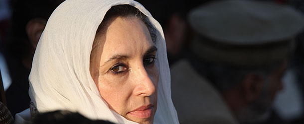 RAWALPINDI, PAKISTAN &#8211; DECEMBER 27: Former Pakistani Prime Minister Benazir Bhutto sits on stage at a campaign rally minutes before she was assassinated in a bomb attack December 27, 2007 in Rawalpindi, Pakistan. The opposition leader has died from wounds to the neck and head after speaking at an election rally in the northern city where an estimated 15 people were left dead by the explosion, party officials have been quoted as saying. (Photo by John Moore/Getty Images) *** Local Caption *** Benazir Bhutto
