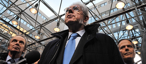 Italian Prime Minister Mario Monti talks to journalists as he arrives at the EU Headquarters on November 22, 2012 in Brussels, to take part in a two-day European Union leaders summit called to agree a hotly-contested trillion-euro budget through 2020. European Union officials were scrambling to find an all but impossible compromise on the 2014-2020 budget that could successfully move richer nations looking for cutbacks closer to poorer ones who look to Brussels to prop up hard-hit industries and regions. AFP PHOTO / GEORGES GOBET (Photo credit should read GEORGES GOBET/AFP/Getty Images)
