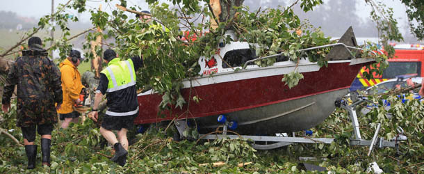 AUCKLAND, NEW ZEALAND &#8211; DECEMBER 06: Storm debri is cleared from a boat in the aftermath of a tornado that hit the suburb of Hobsonville on December 6, 2012 in Auckland, New Zealand. Three people have been confirmed dead and torrential rain has caused surface flooding across Auckland. (Photo by Phil Walter/Getty Images)
