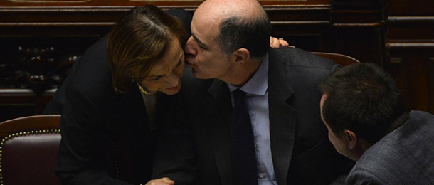 Italian minister for economic development Corrado Passera (R) greets labour minister Elsa Fornero prior a session on a key budget vote on December 21, 2012 at the parliement in Rome. The Italian parliament prepared Friday for a key budget vote which will trigger the resignation of Prime Minister Mario Monti, who is expected to reveal this weekend whether he will run in the upcoming election. AFP PHOTO / ALBERTO PIZZOLI (Photo credit should read ALBERTO PIZZOLI,ALBERTO PIZZOLI/AFP/Getty Images)

