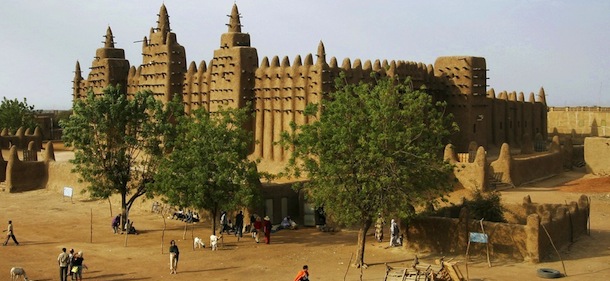 This photo taken on February 9, 2005, shows the Great Mosque of Djenne in the Niger Delta region in central Mali. The first mosque in the complex was built in the 13th century, while the current mosque dates back to 1907 and is the largest earthen mud building in the world. The Great Mosque was designated as a World Heritage Site by UNESCO in 1988. The UN Security Council on July 4, 2012, threatened sanctions against the Islamist fighters who have destroyed Muslim shrines in northern Mali, and supported, without giving a UN mandate, a proposed African military intervention force by the ECOWAS West-African countries, diplomats said. Meanwhile Mali's national assembly on July 4, 2012, called for army intervention in the north where Islamists have enforced strict sharia law, destroyed ancient shrines and trapped residents with landmines. AFP PHOTO / FRANCOIS XAVIER MARIT (Photo credit should read FRANCOIS XAVIER MARIT/AFP/GettyImages)