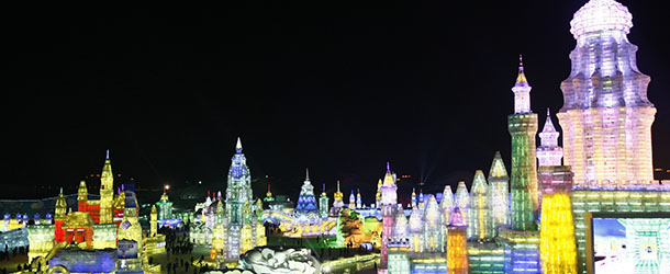 This picture taken on January 5, 2013 shows people visiting Ice and Snow World during the opening ceremony of the 2013 Harbin International Ice and Snow Festival in Harbin, in northeast China's Heilongjiang province. This year's "Ice and Snow World" features majestic ice castles and sculptures of fairytale characters equipped with LED lights, bringing a colourful and warm aura to the icy wonderland. CHINA OUT AFP PHOTO (Photo credit should read STR/AFP/Getty Images)